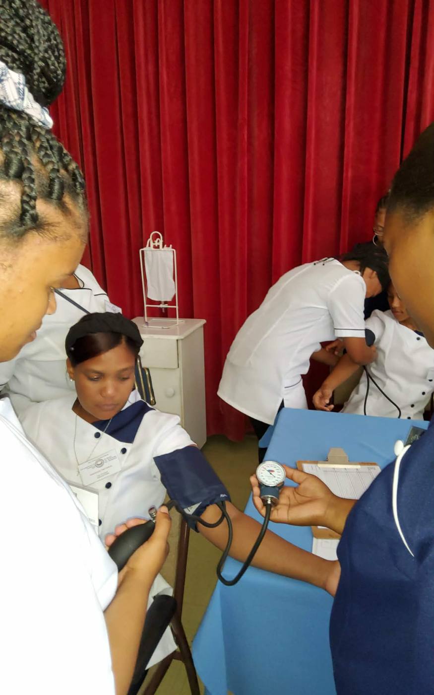 Students practising blood pressure measurement